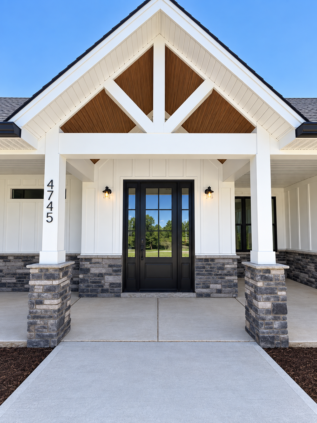 modern farmhouse front entrance with black doors built by Gold C Builders near Lake Norman NC